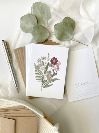 Write your message alongside the pressed flowers for a charming and personal touch