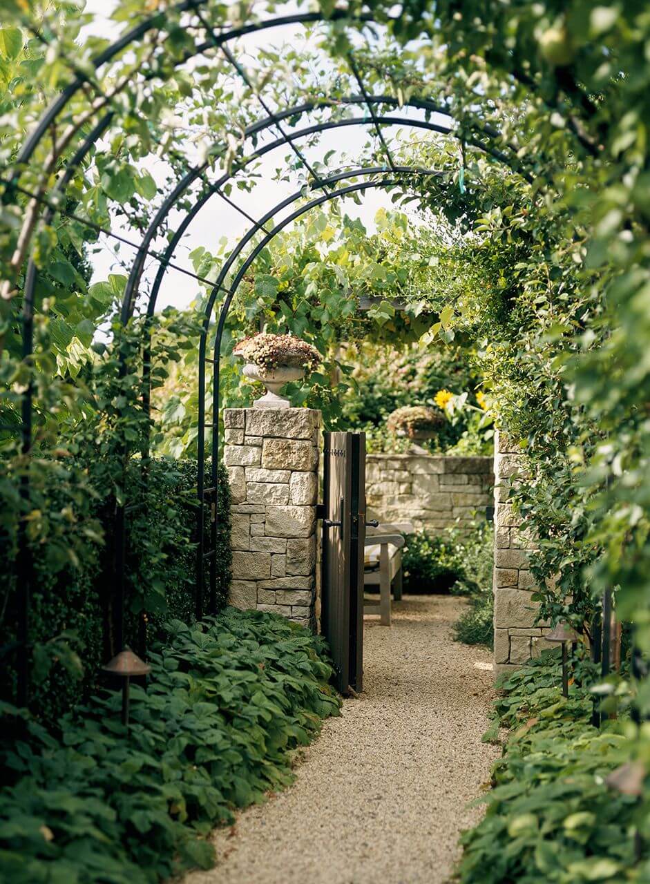 Enhance the vertical appeal of your mom's garden with decorative trellises and arbours