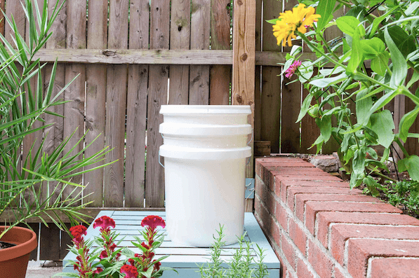 Encourage sustainable gardening practices with a compost bin for organic waste recycling