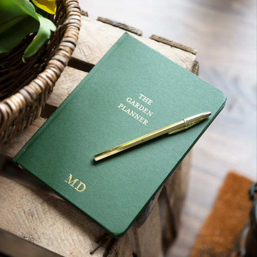 Gift a personalised garden journal or notebook with the recipient's name embossed on the cover