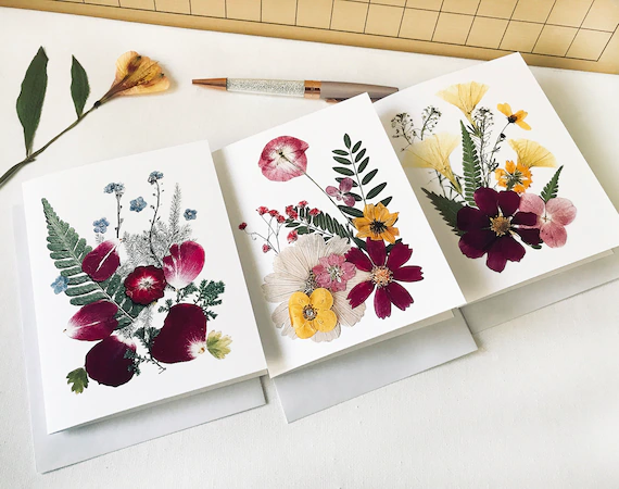 Create a charming birthday card by pressing flowers from your own garden or local blooms