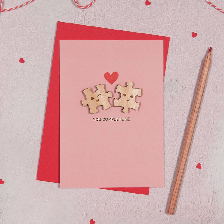 Symbolise the special connection between the new mom and her baby by creating a card using puzzle pieces